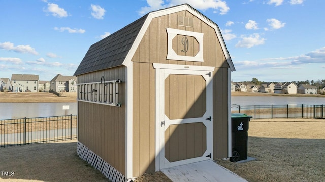 view of outbuilding with a water view