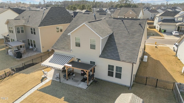 rear view of property featuring a patio area