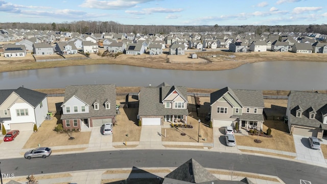 drone / aerial view with a water view