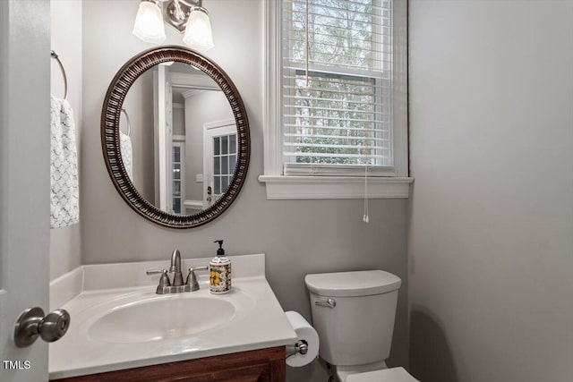 bathroom with vanity and toilet