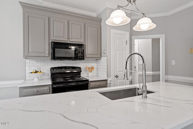 kitchen featuring ornamental molding, gray cabinets, sink, and black appliances