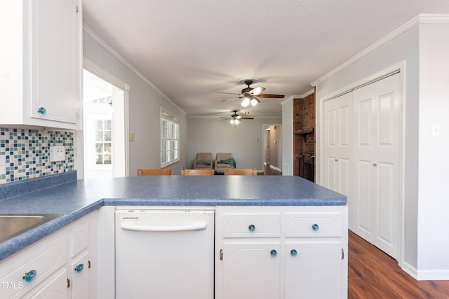 kitchen with white dishwasher, white cabinetry, and ornamental molding