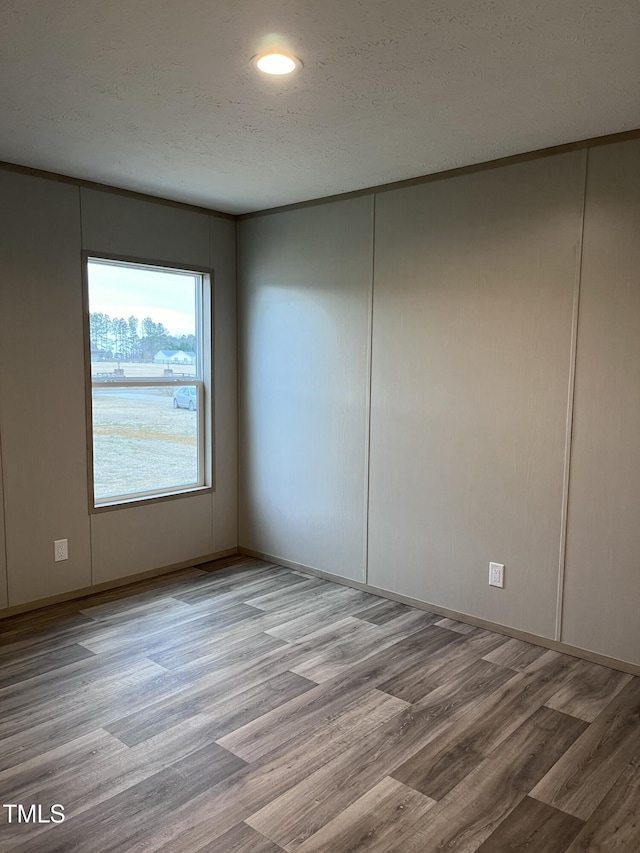 spare room featuring hardwood / wood-style flooring