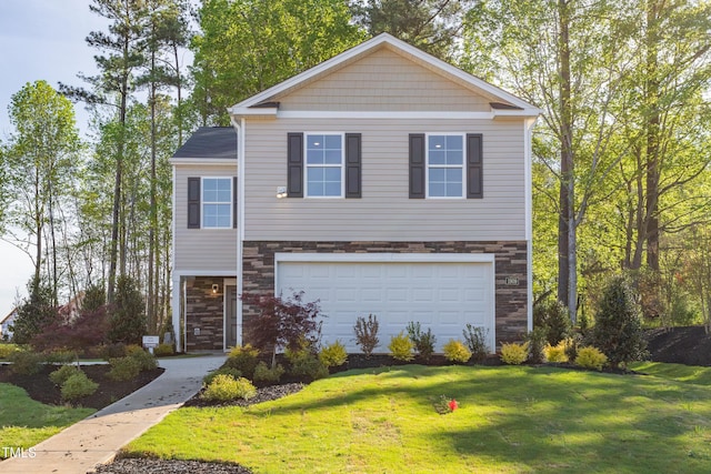 view of front of home with a garage and a front lawn