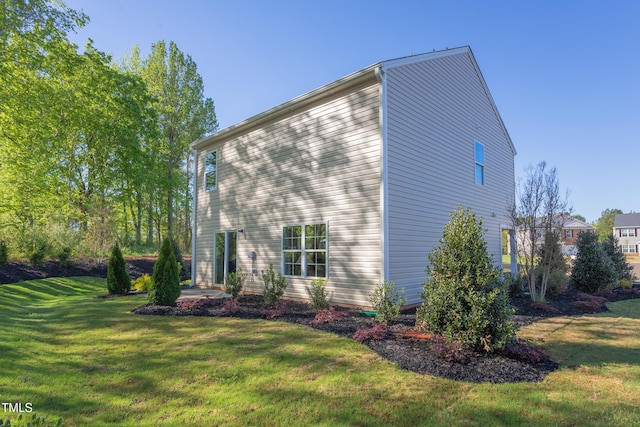 view of property exterior featuring a yard