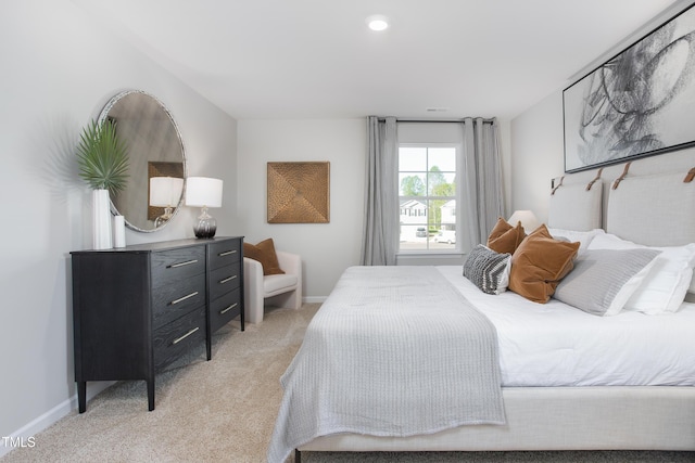 bedroom with light colored carpet