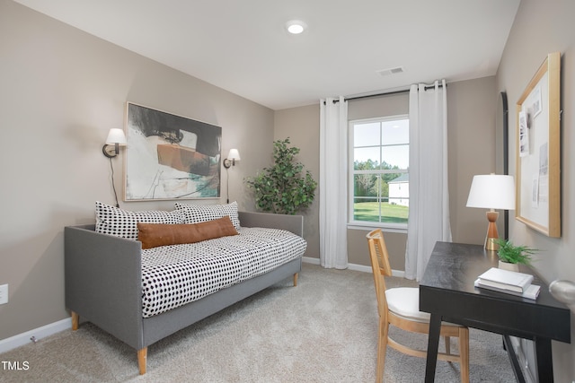 bedroom with light colored carpet