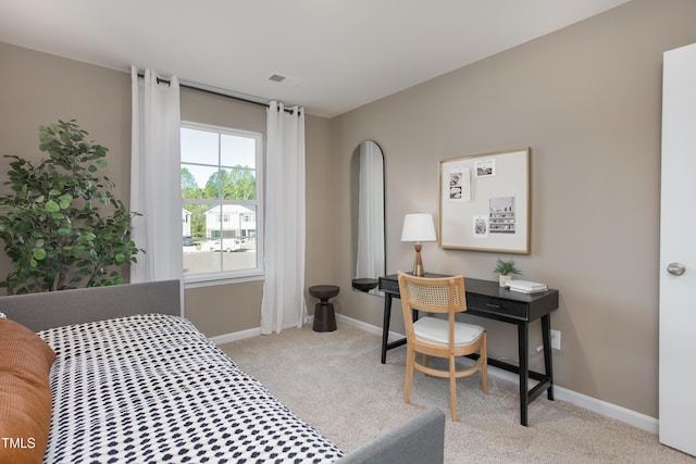 bedroom with light colored carpet