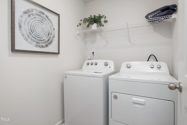 laundry area with independent washer and dryer