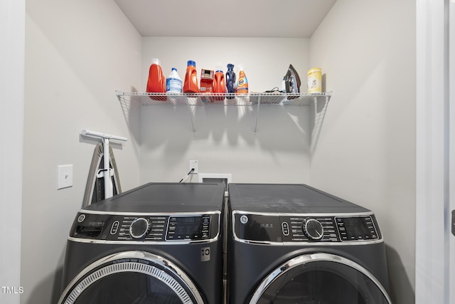 laundry room with washer and clothes dryer