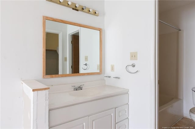 full bathroom with vanity, toilet,  shower combination, and tile patterned flooring