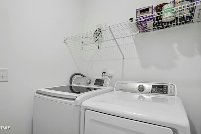 laundry room featuring washer and clothes dryer