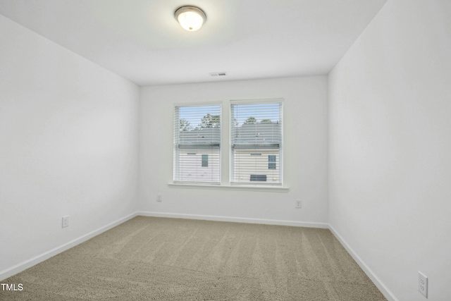 unfurnished room featuring carpet