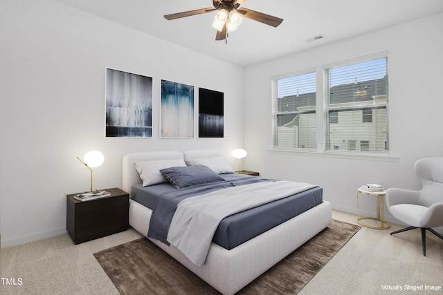 carpeted bedroom with ceiling fan