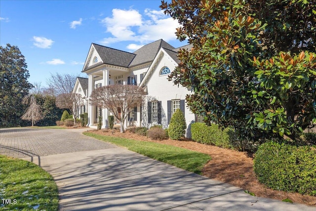 view of front of house with decorative driveway