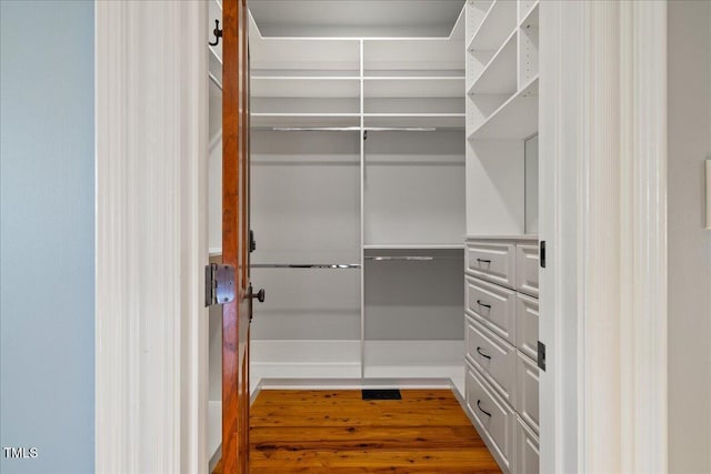 spacious closet featuring wood finished floors