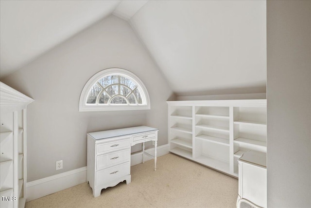 office space with lofted ceiling and baseboards