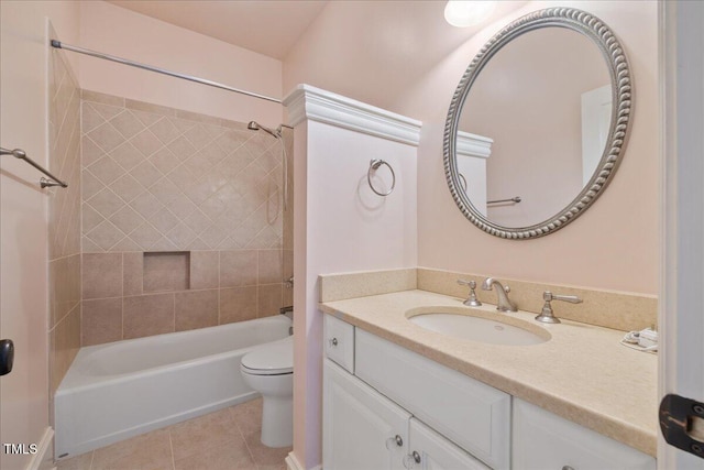 bathroom with tile patterned floors, vanity, toilet, and shower / bathtub combination