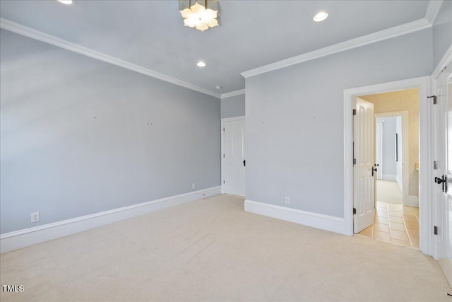 unfurnished bedroom with recessed lighting, baseboards, ornamental molding, and light colored carpet