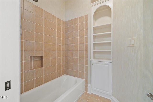 bathroom featuring tile patterned flooring and shower / tub combination