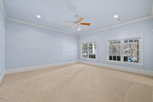 unfurnished room featuring baseboards, visible vents, crown molding, and light colored carpet