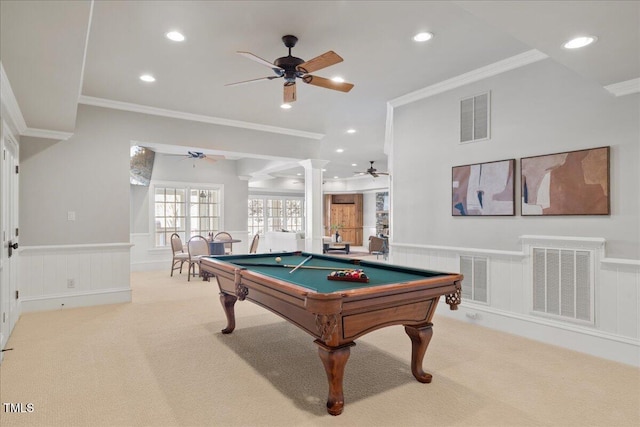 rec room with a wainscoted wall, decorative columns, visible vents, and light colored carpet