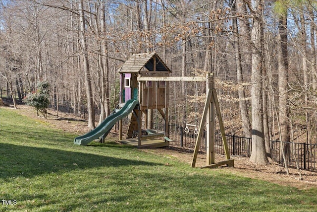 view of play area featuring a yard and fence