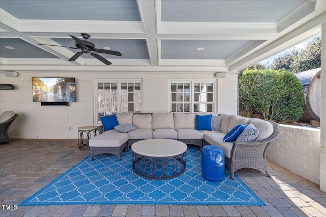 view of patio featuring an outdoor living space and a ceiling fan