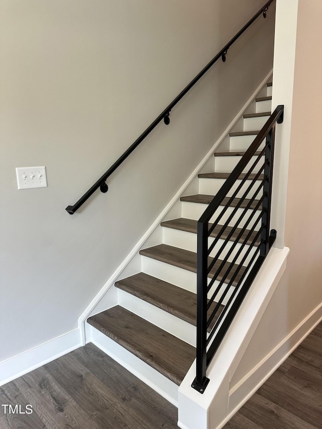 staircase featuring hardwood / wood-style floors