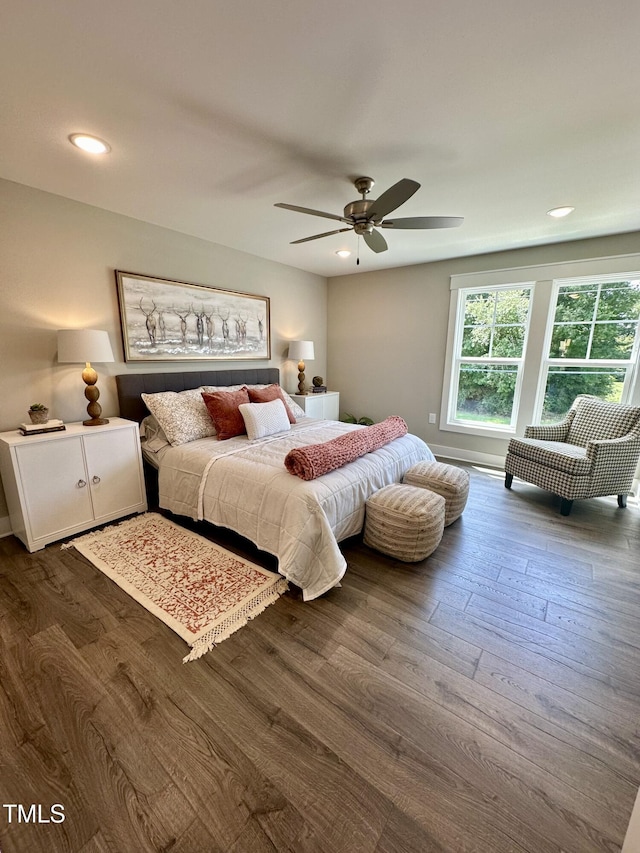 bedroom featuring ceiling fan and dark hardwood / wood-style floors