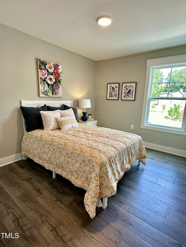 bedroom featuring dark hardwood / wood-style flooring