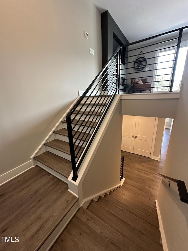 staircase featuring hardwood / wood-style floors