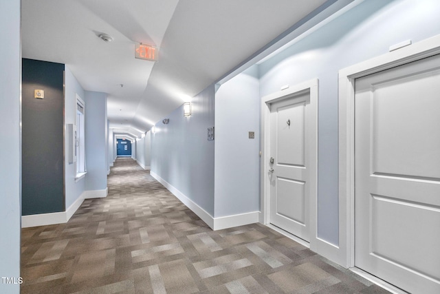 corridor with carpet flooring