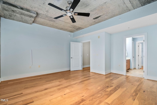 spare room with light hardwood / wood-style floors and ceiling fan