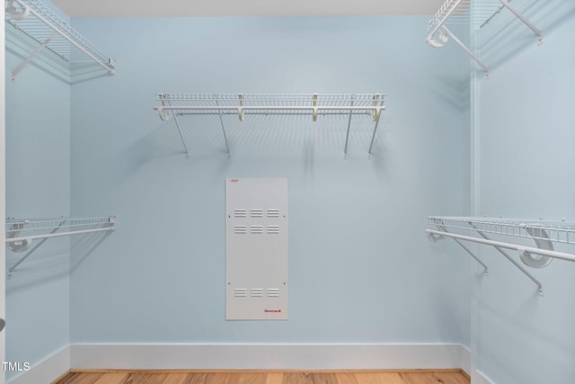 spacious closet featuring hardwood / wood-style floors