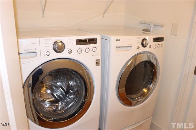 washroom with washing machine and dryer