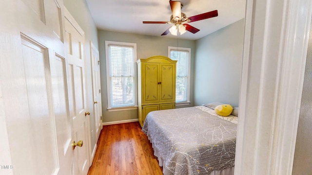 bedroom with wood-type flooring and ceiling fan