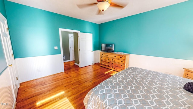 bedroom with ceiling fan and hardwood / wood-style floors