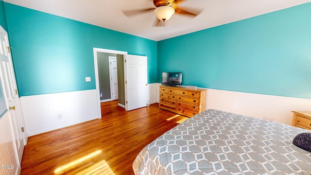 bedroom with wood-type flooring and ceiling fan