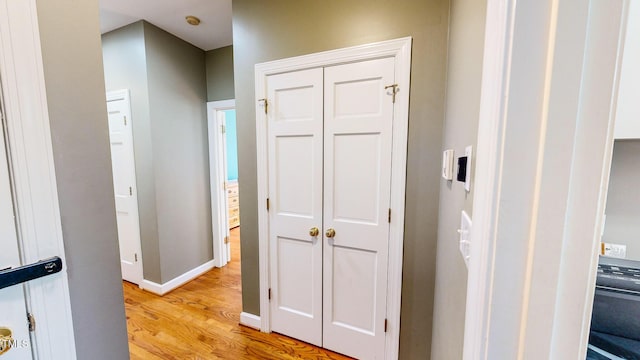 corridor featuring light hardwood / wood-style floors