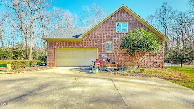 view of side of home featuring a garage