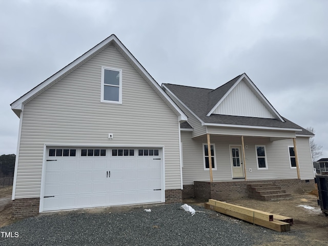 view of front of home with a garage and covered porch