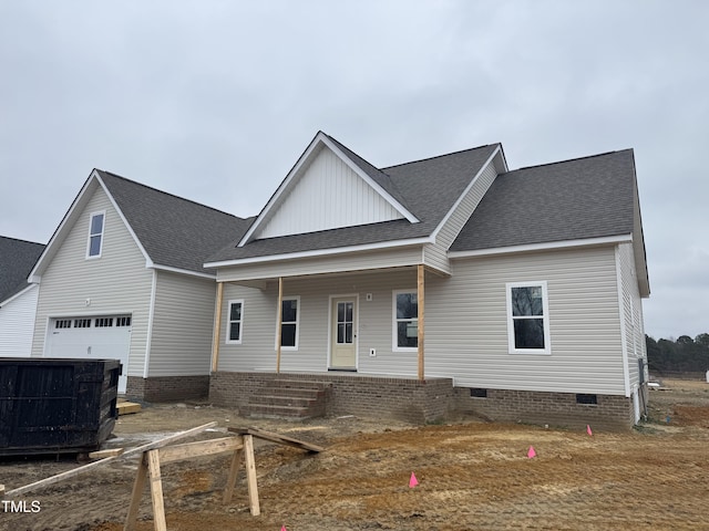 view of front facade featuring a garage and covered porch