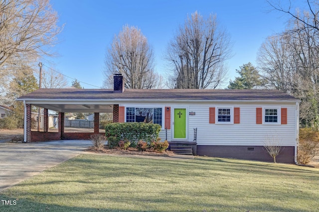 view of front of house with a carport and a front lawn