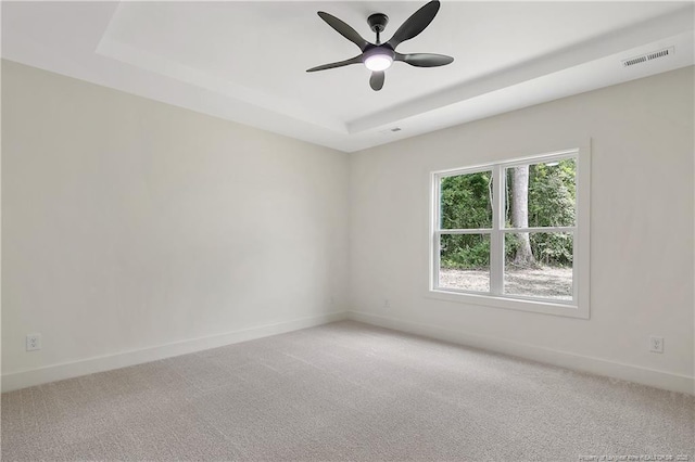 5210 Maxwell Rd, Stedman, NC 28391 - empty room with a tray ceiling, light colored carpet, ceiling fan, and baseboards