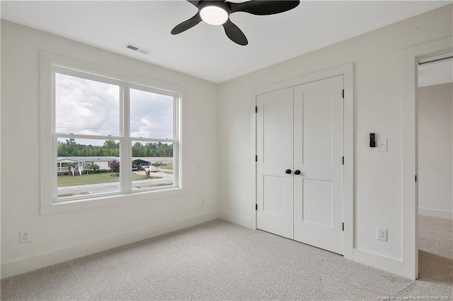 5210 Maxwell Rd, Stedman, NC 28391 - unfurnished bedroom featuring carpet, baseboards, a ceiling fan, and a closet