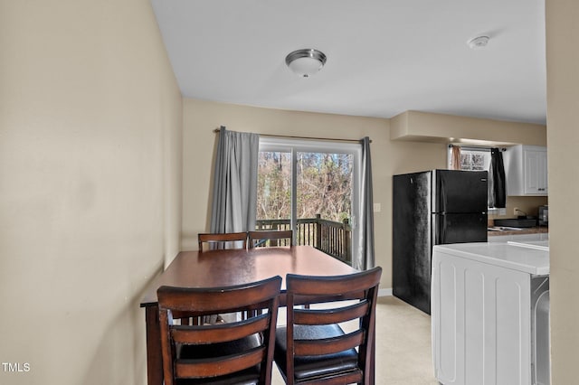 dining area featuring washer / dryer