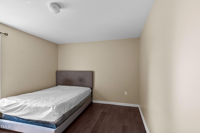 bedroom featuring dark hardwood / wood-style flooring