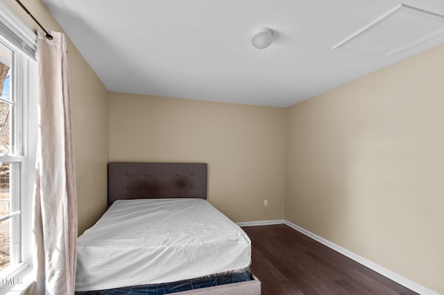 bedroom featuring dark wood-type flooring