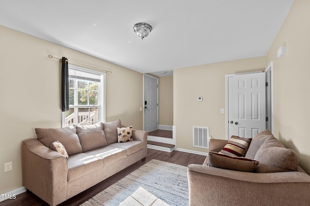 living room with dark hardwood / wood-style floors